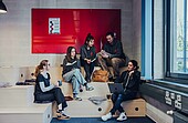 Students on a staircase in the creative space