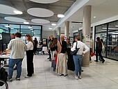 Prospective students in the foyer in front of the new library, Building C